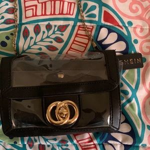 This is a black and see through purse from shein. With a reversal wallet.